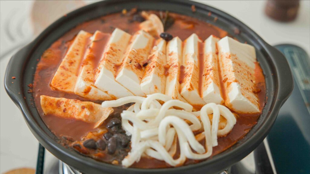 adding noodles to kimchi jjigae