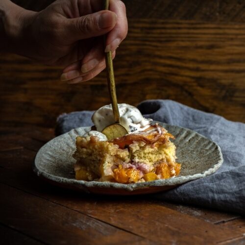 A Piece of Peach Cobbler on a Plate.