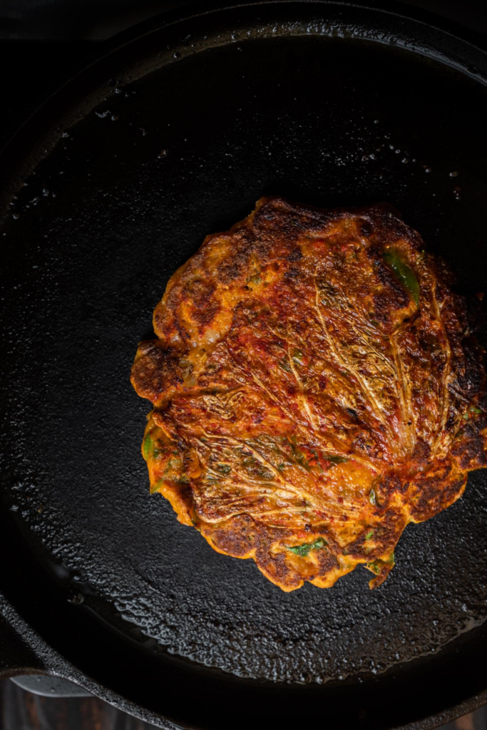 kimchi pancake on cast iron pan
