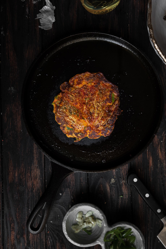 kimchi pancake on cast iron pan
