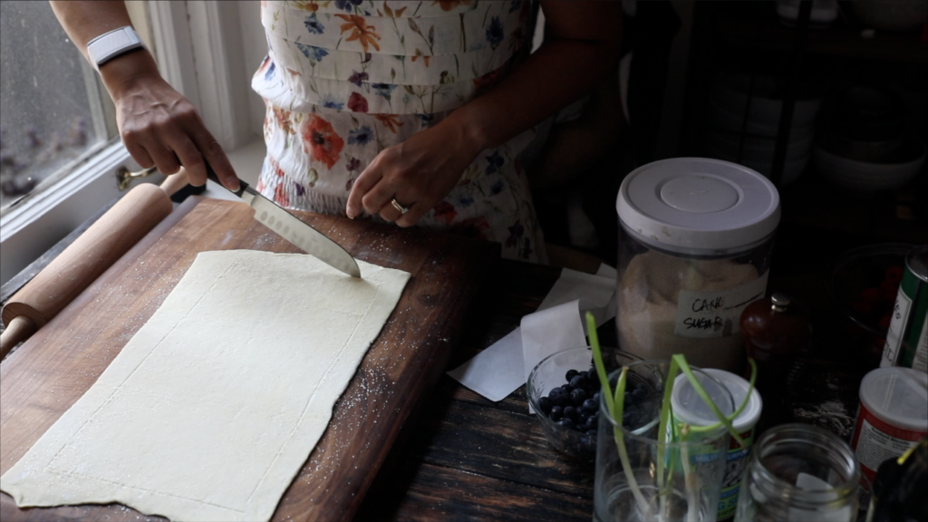 showing how to score the puff pastry dough