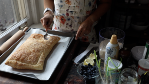 tapping down the center of the puff pastry