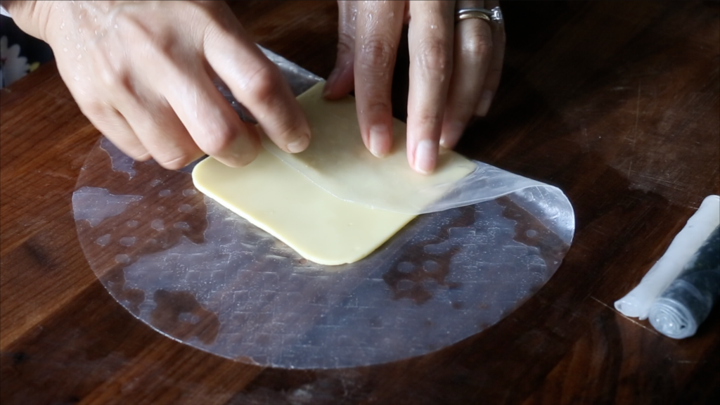adding cheese to the rice paper