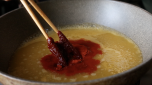 creating the sauce for the tteokbokki