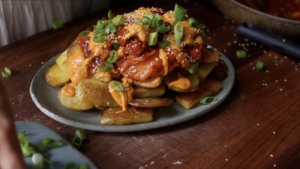 Top the kimchi fries with everything