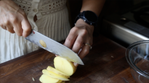 slicing up the potatoes