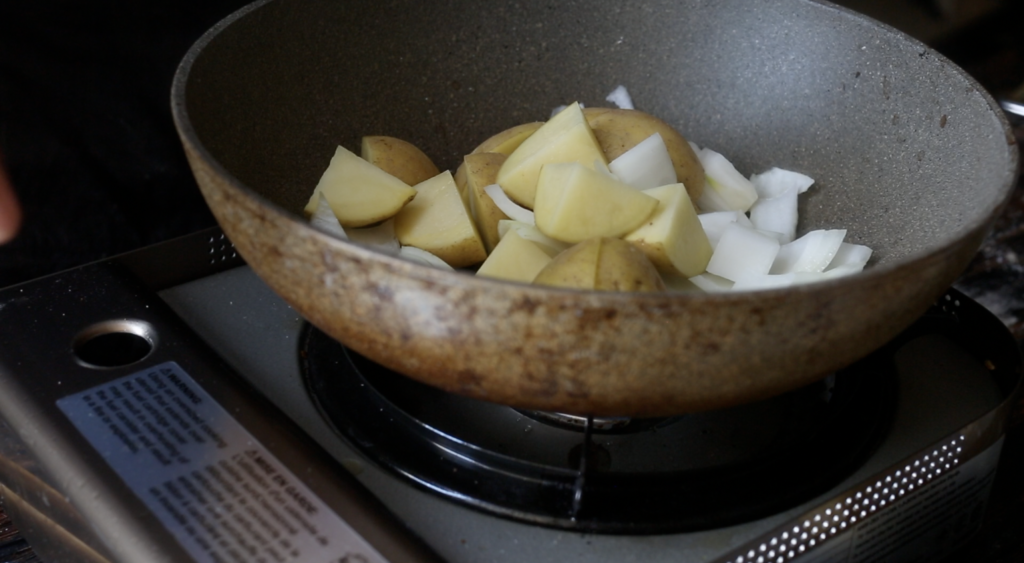 add onions, garlic, and potato to pan