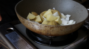 add onions, garlic, and potato to pan