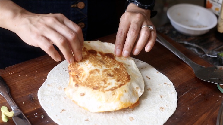 Adding the small tortilla to everything.