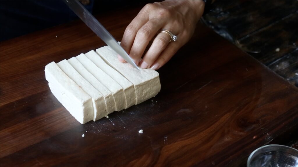 slicing block of extra firm tofu