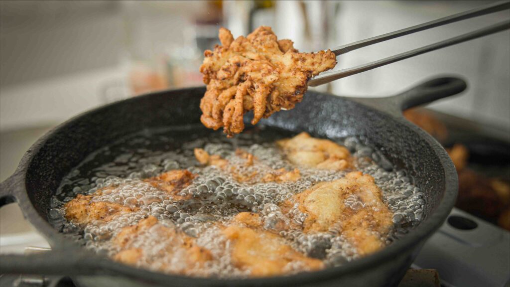 Piece-of-vegan-fried-chicken-coming-out-of-fryer