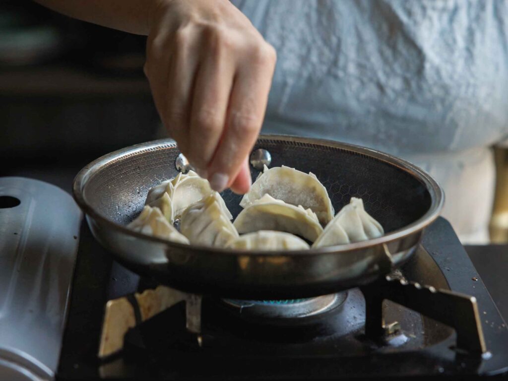 adding-potstickers-to-pan