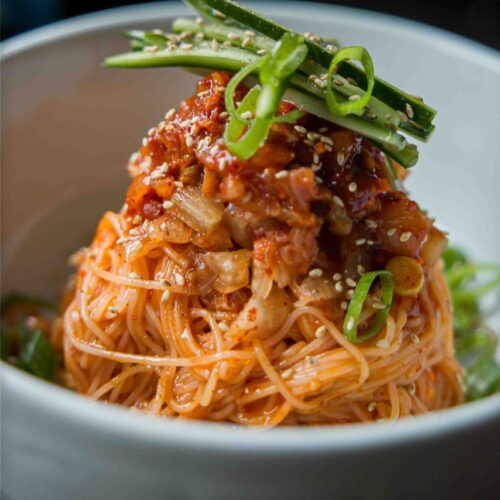 close up shot of bibim kimchi noodles