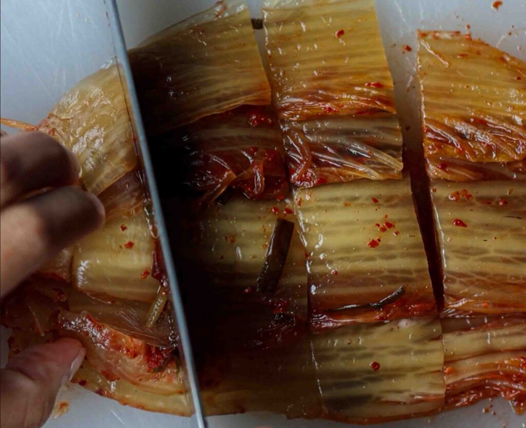 cutting kimchi for kimchi noodles
