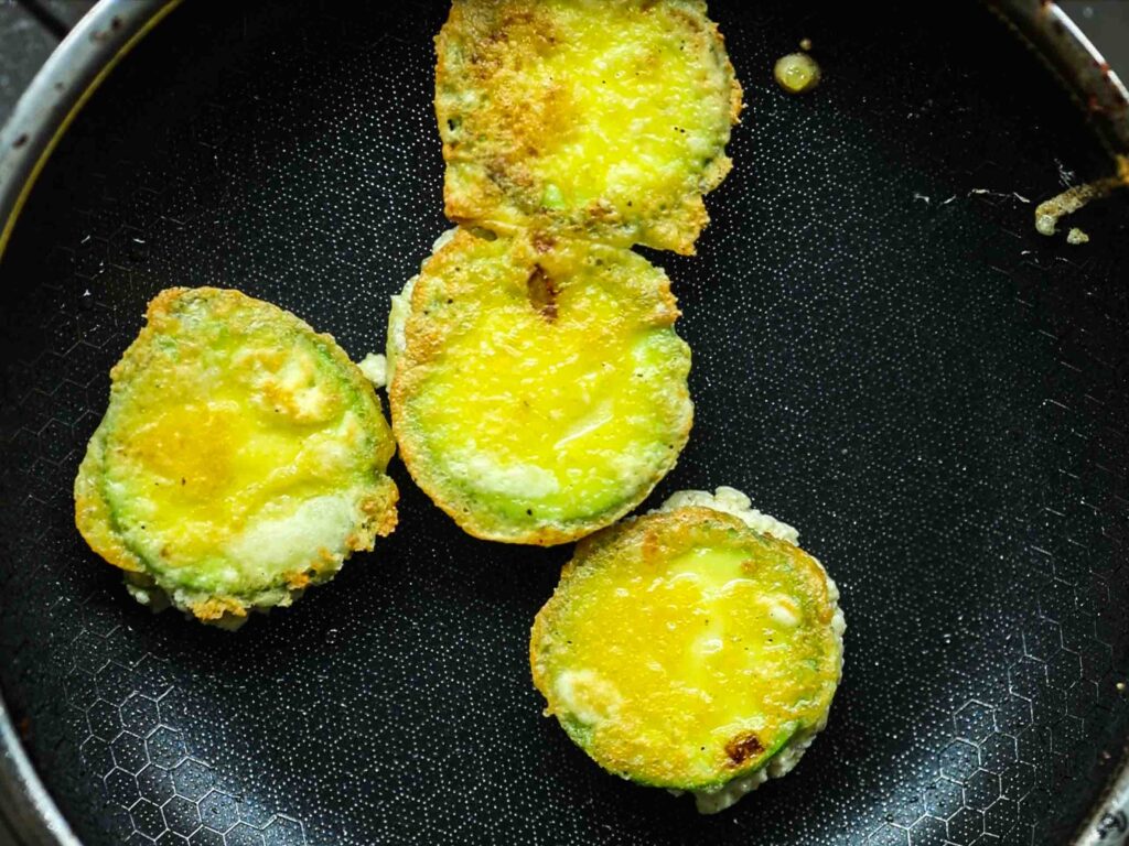 flipped-zucchini-fritters-in-pan-