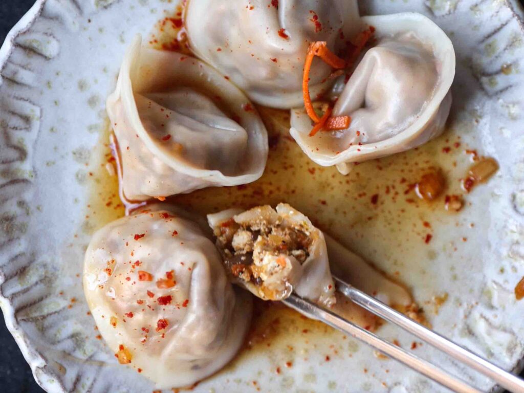 plate-of-finished-boiled-dumplings-showing-insides