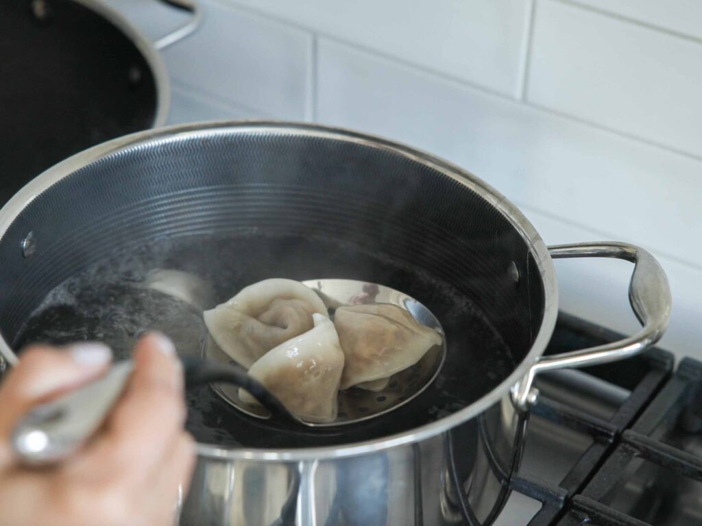 removing-boiled-dumplings-from-pot-of-water