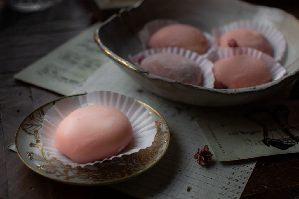One-main-pink-mochi-in-small-plate-with-others-behind