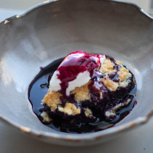 baked vegan blueberry cobbler with ice cream