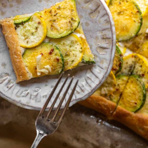 close up shot of piece of zucchini tart with fork