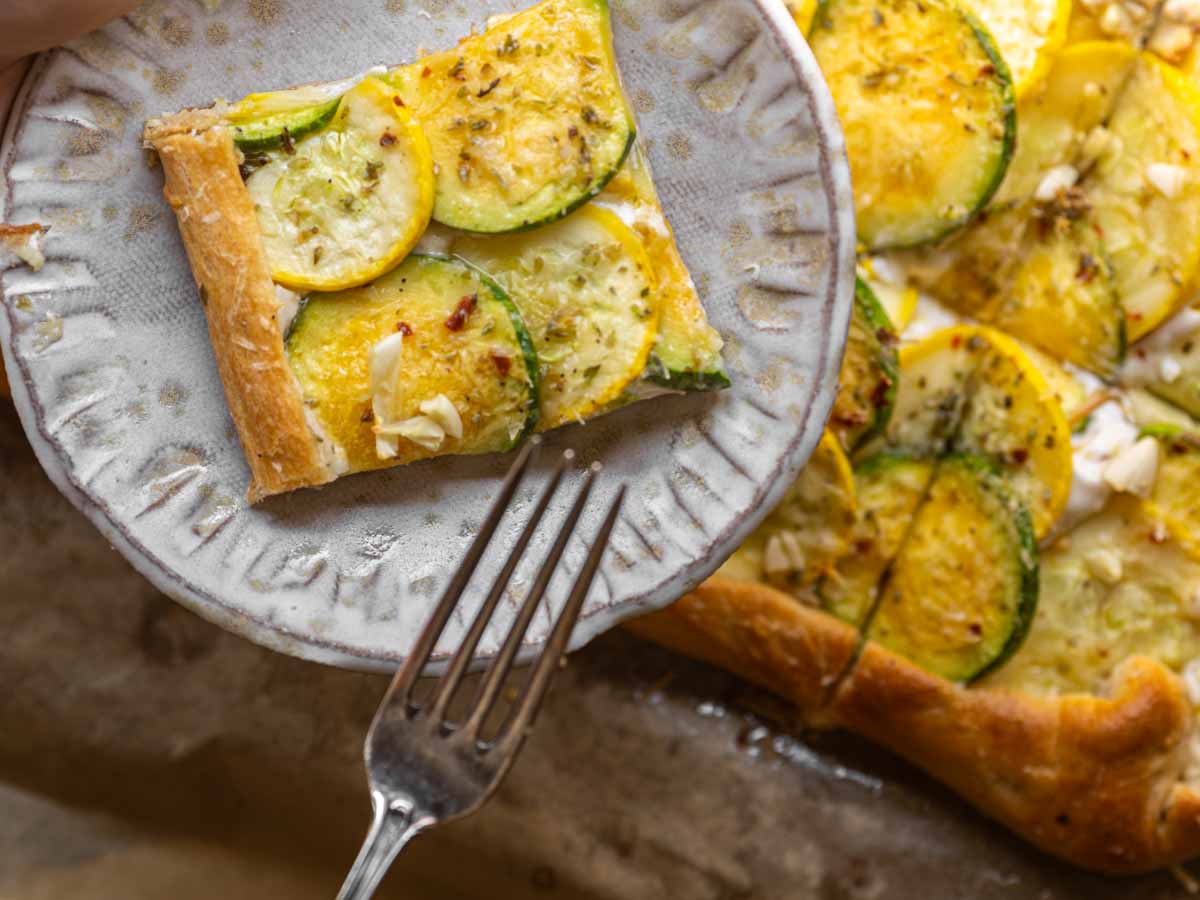 close up shot of piece of zucchini tart with fork