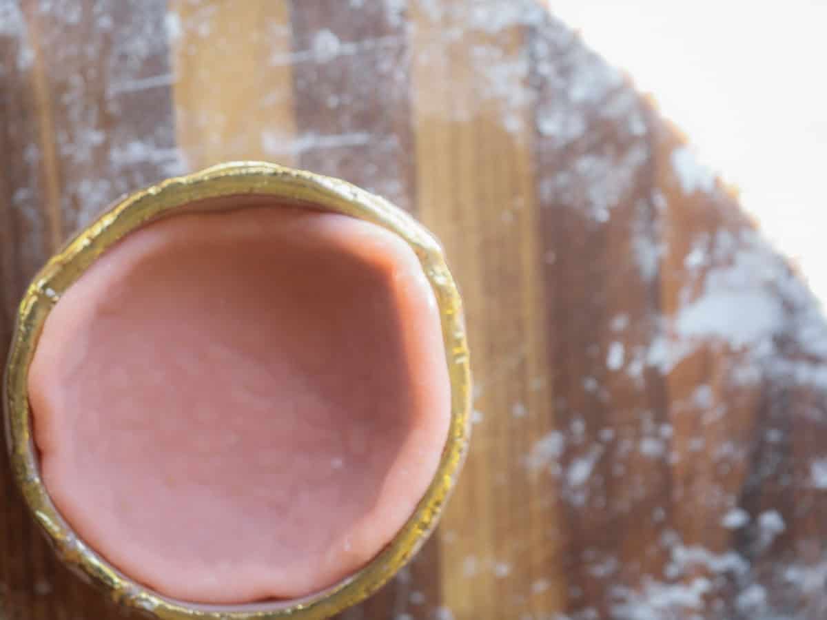 pink-mochi-disc-inside-small-bowl-for-shaping