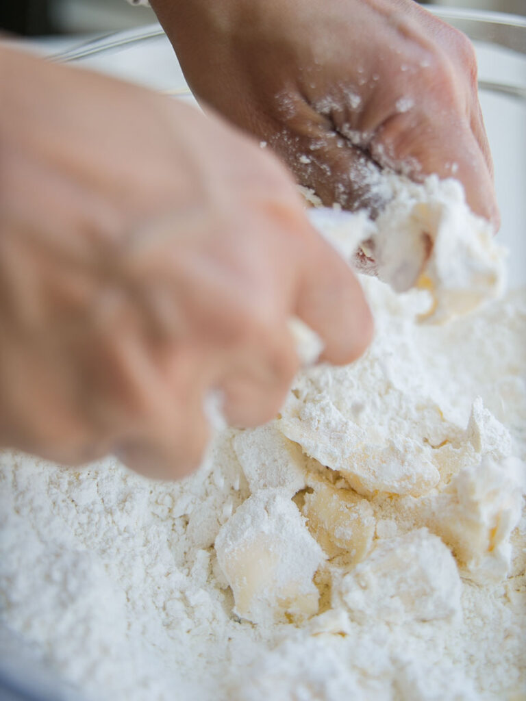 using-hands-to-incorporate-butter-in-flour