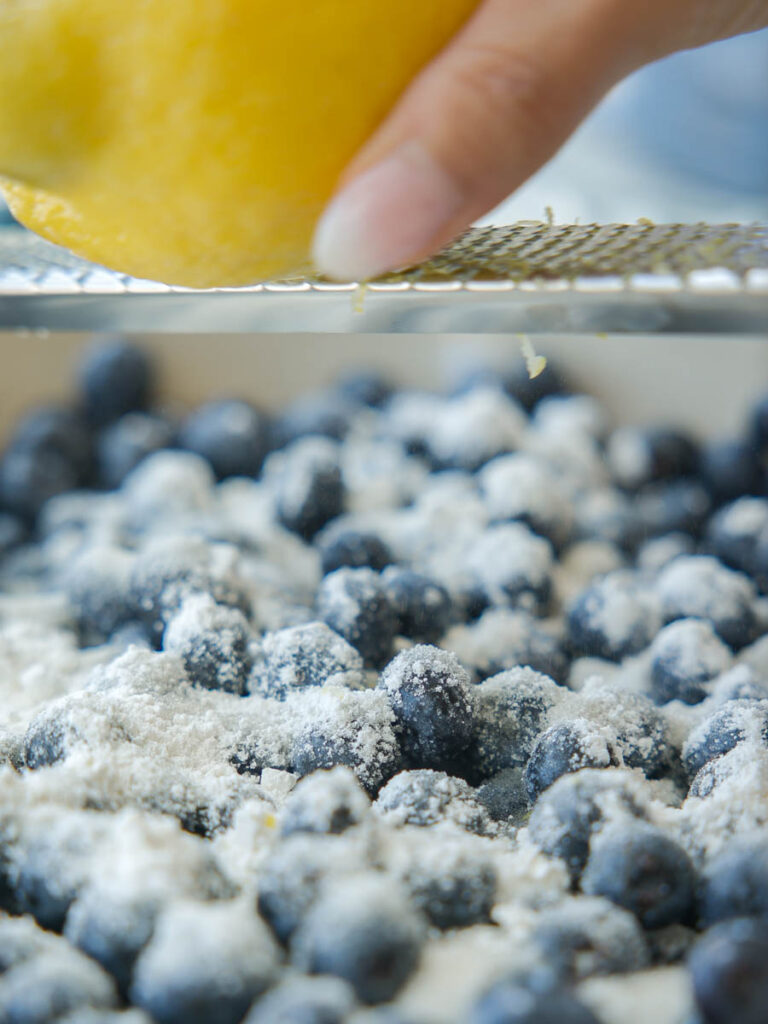 zesting-lemon-into-blueberries