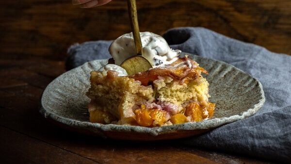 A Piece of Peach Cobbler on a Plate.