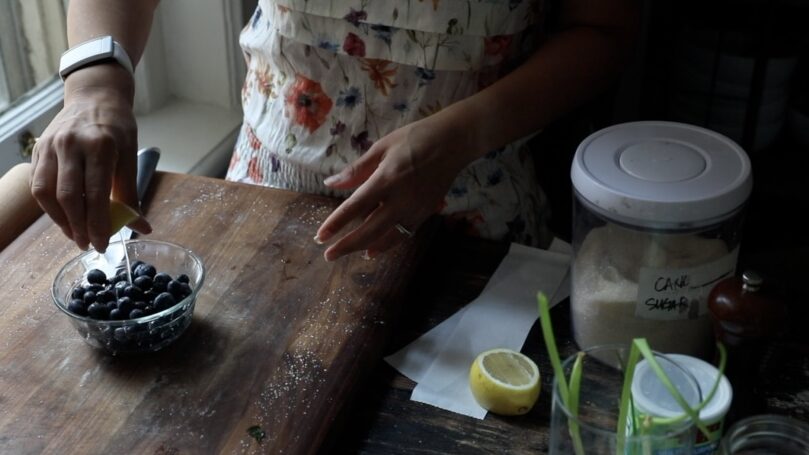 Adding lemon juice to fresh blueberries