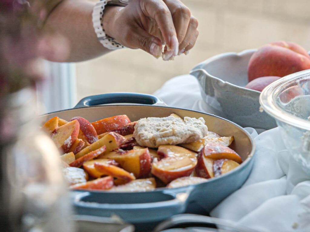 adding-biscuit-topping-to-peache