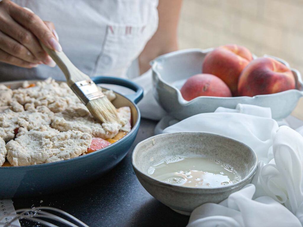 brushing-biscuit-topping-with-vegan-egg-wash