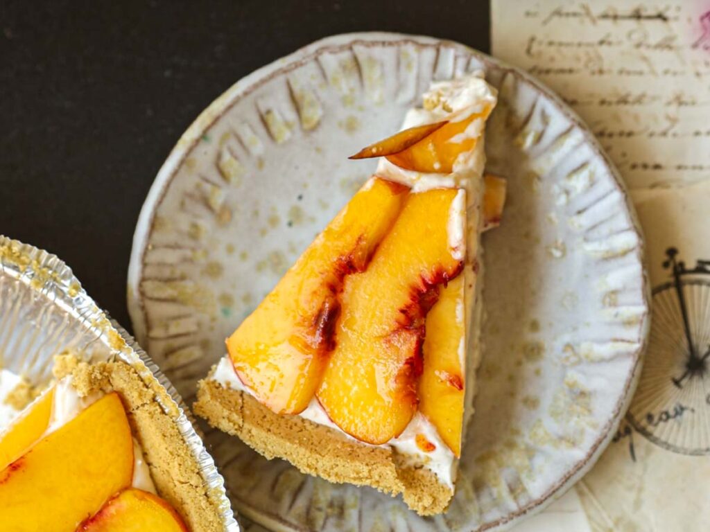 gorgeous-top-down-shot-of-slice-of-vegan-peaches & cream-cheesecake