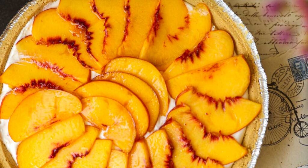 hero-image-of-vegan-peaches & cream-cheesecake