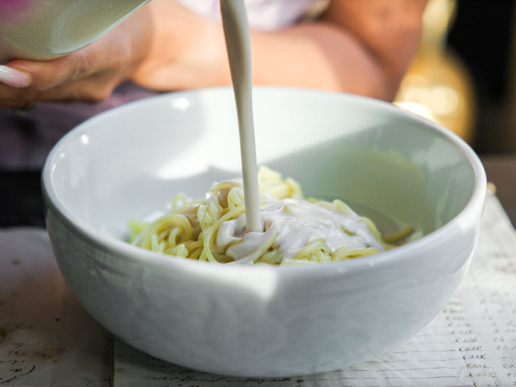 pouring-soy-milk-over-noodles