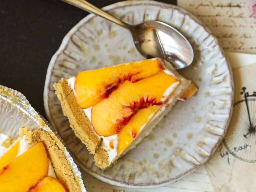 slice-of-vegan-peaches-cream-cheesecake-with-spoon