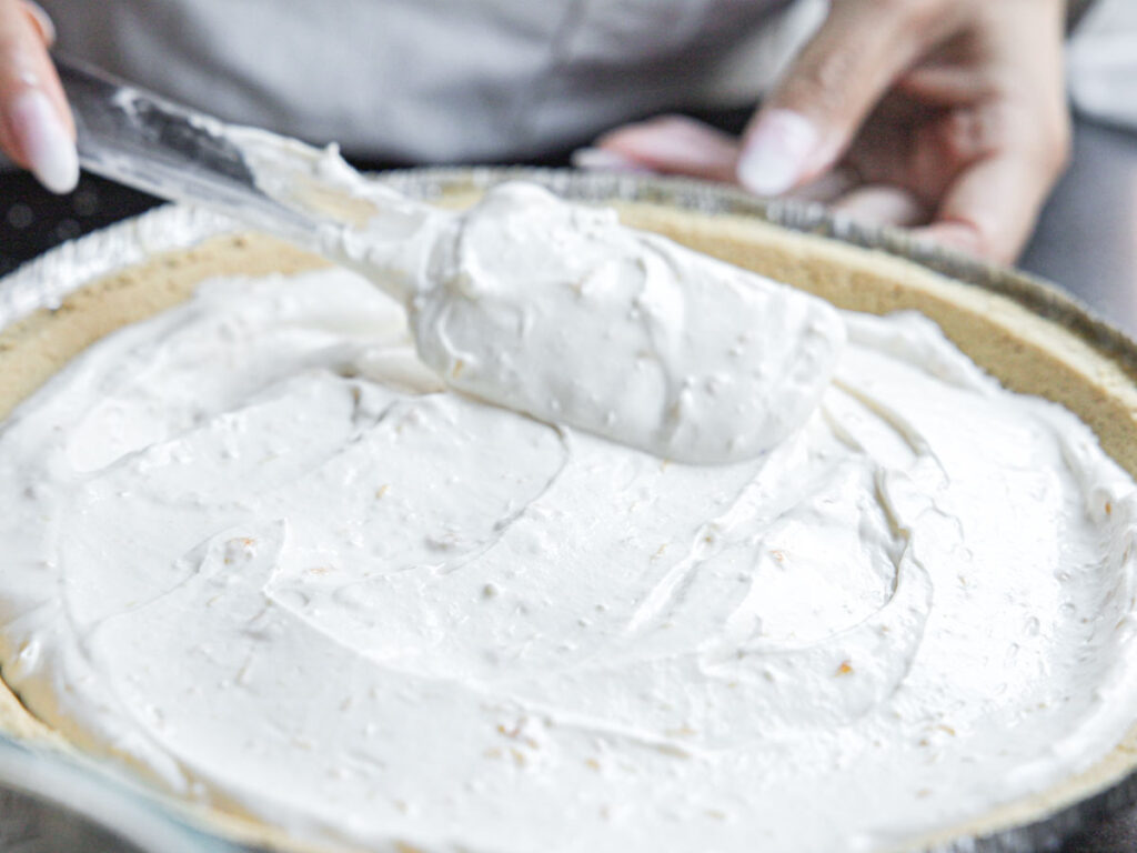 smoothing-out-cream-cheese-filling-in-crust