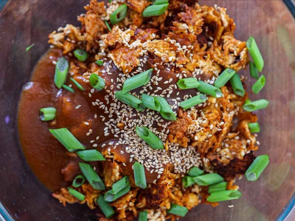 adding-green-onions-to-shredded-tofu