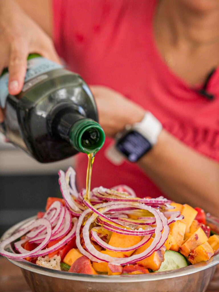 adding-olive-oil-to-bread-salad