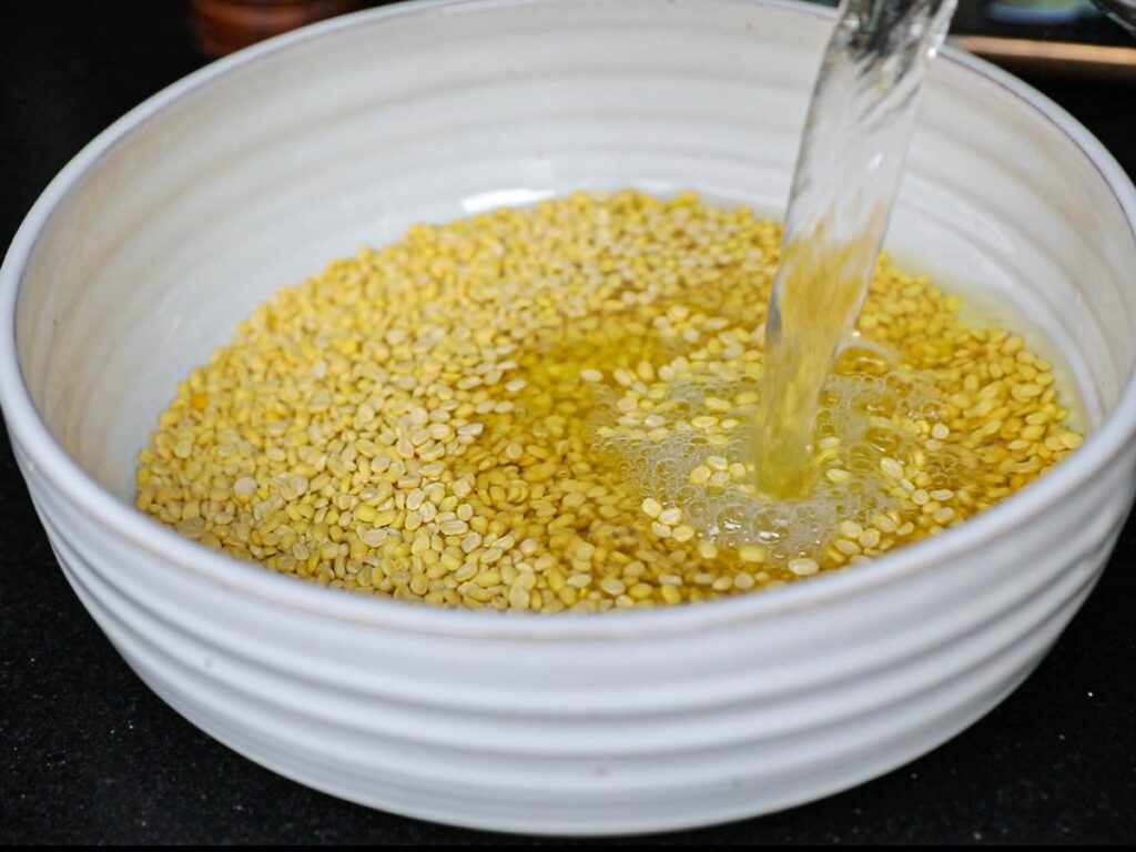 adding-water-to-bowl-of-dried-split-yellow-mung-beans