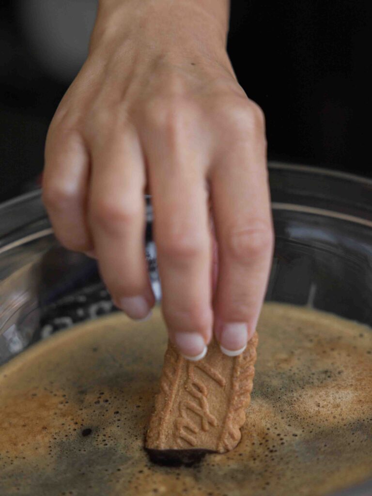 dipping-biscoff-cookie-into-espresso-syrup-scaled