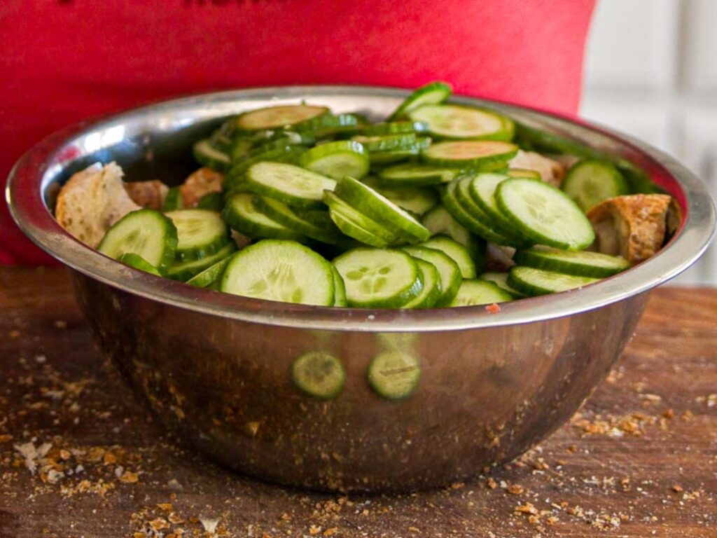 sliced-cucumbers-in-bowl-with-bread