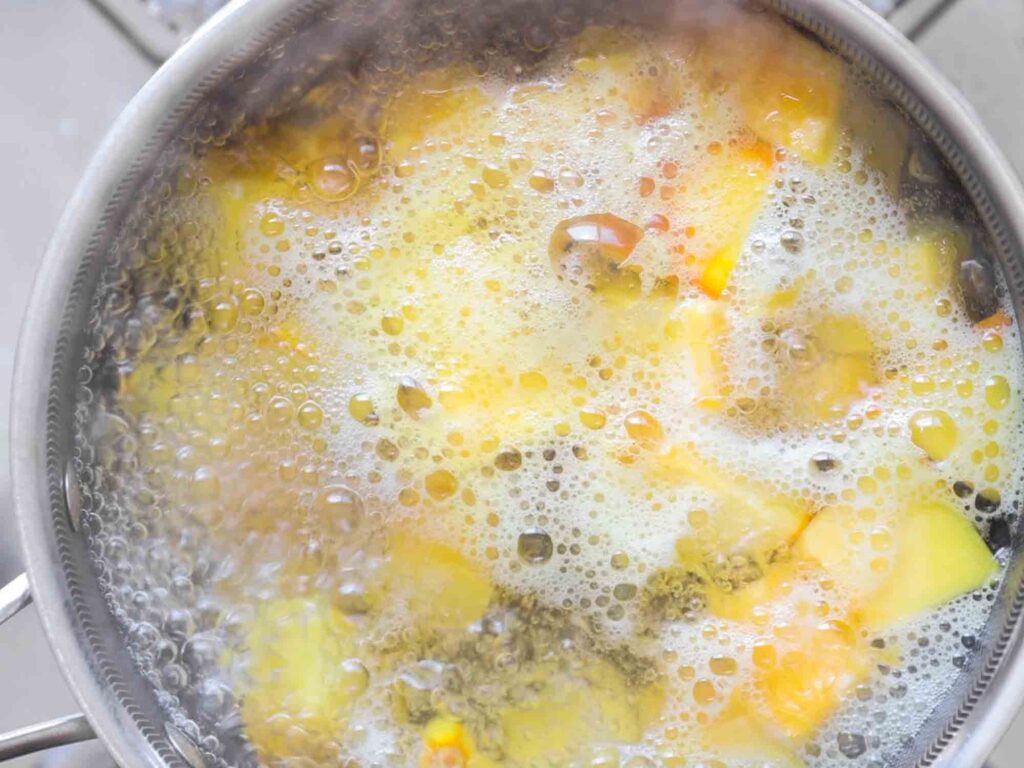 pot of boiling pumpkin cubes