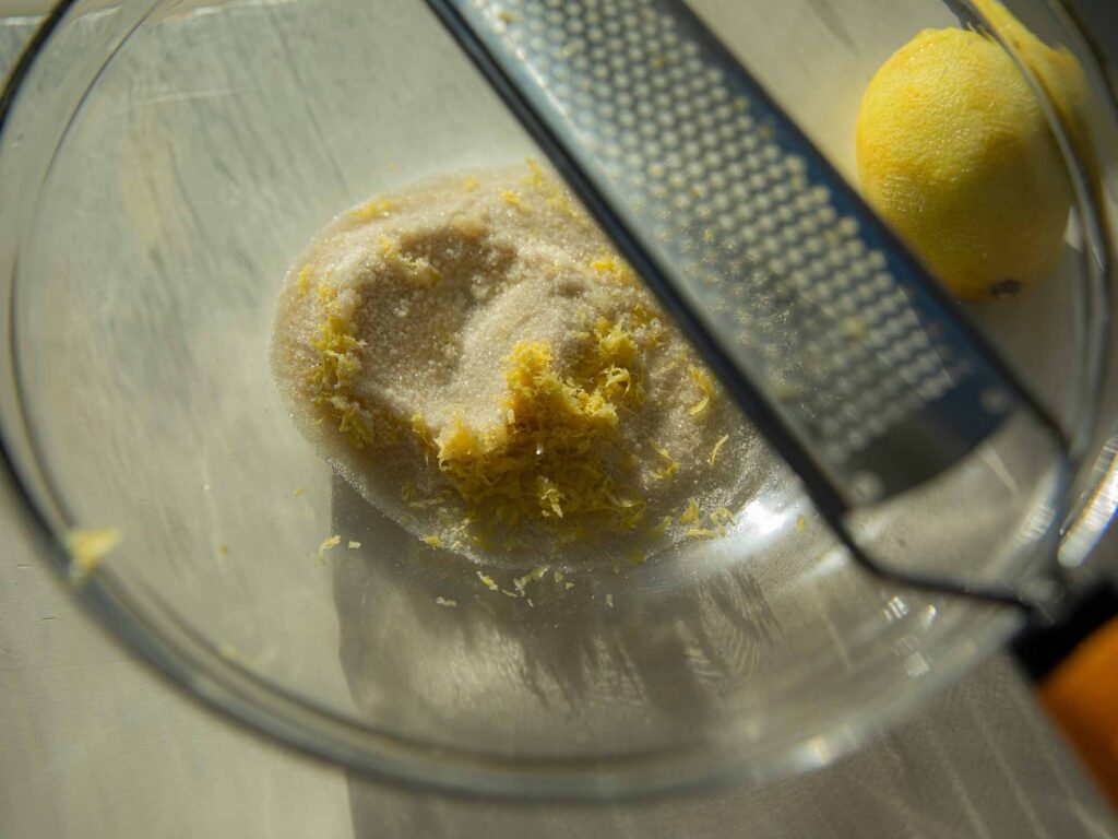 zesting lemon into sugar