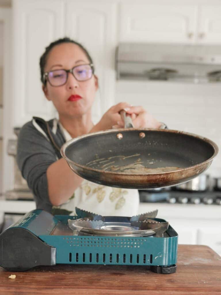 swiveling pan to melt sugar