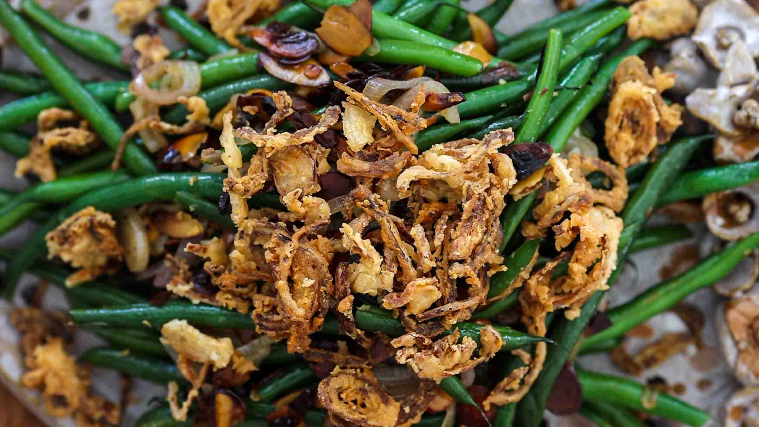 hero image of green beans with french fried shallots