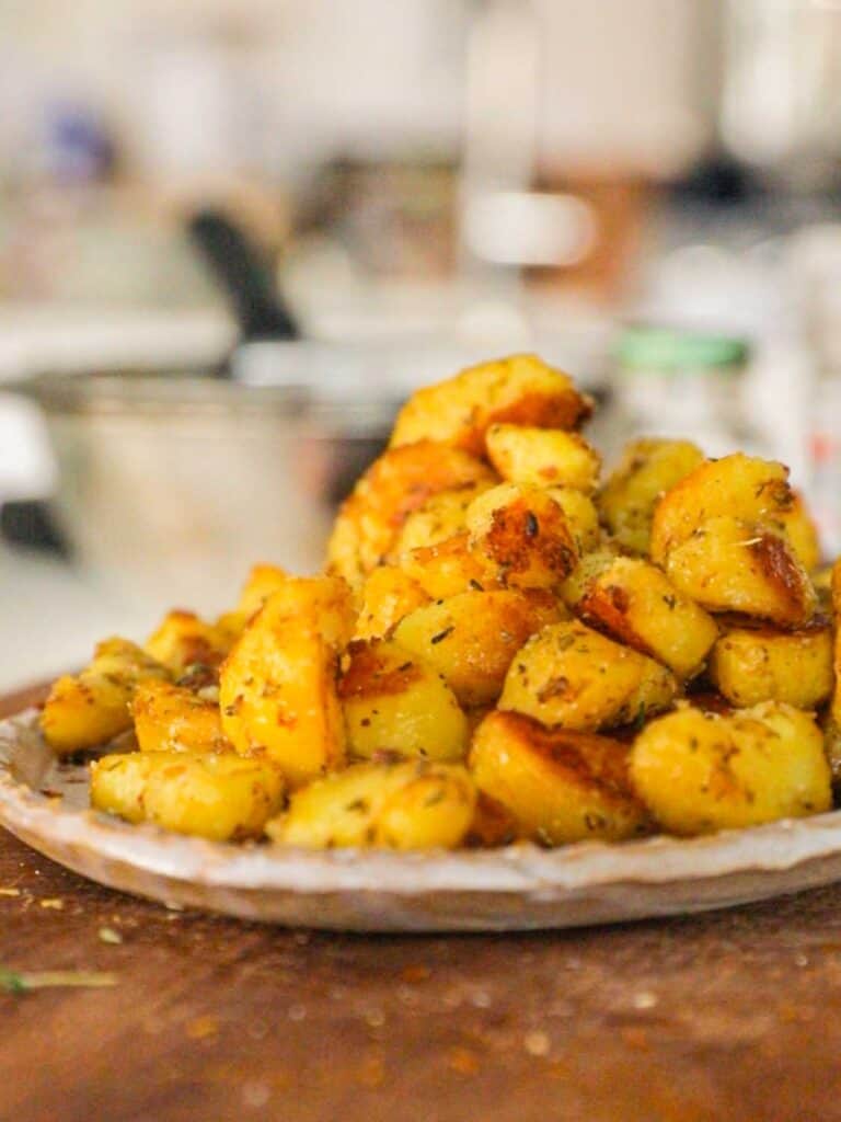 side view of garlicky roasted potatoes