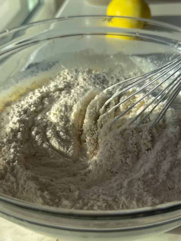 adding dry ingredients to wet ingredients