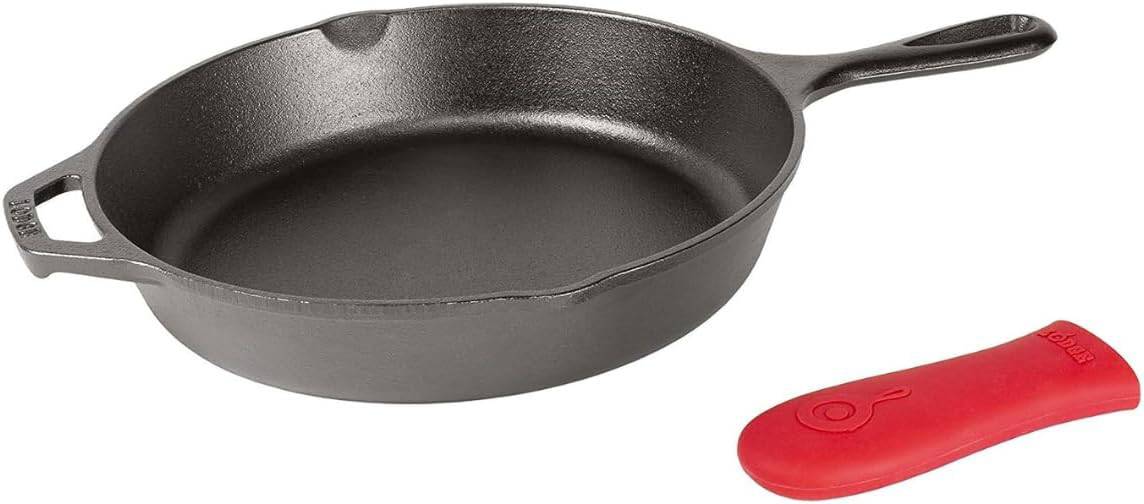 A black cast iron skillet with a red silicone handle cover. It features a small lip for pouring and a branded logo on the handle cover.