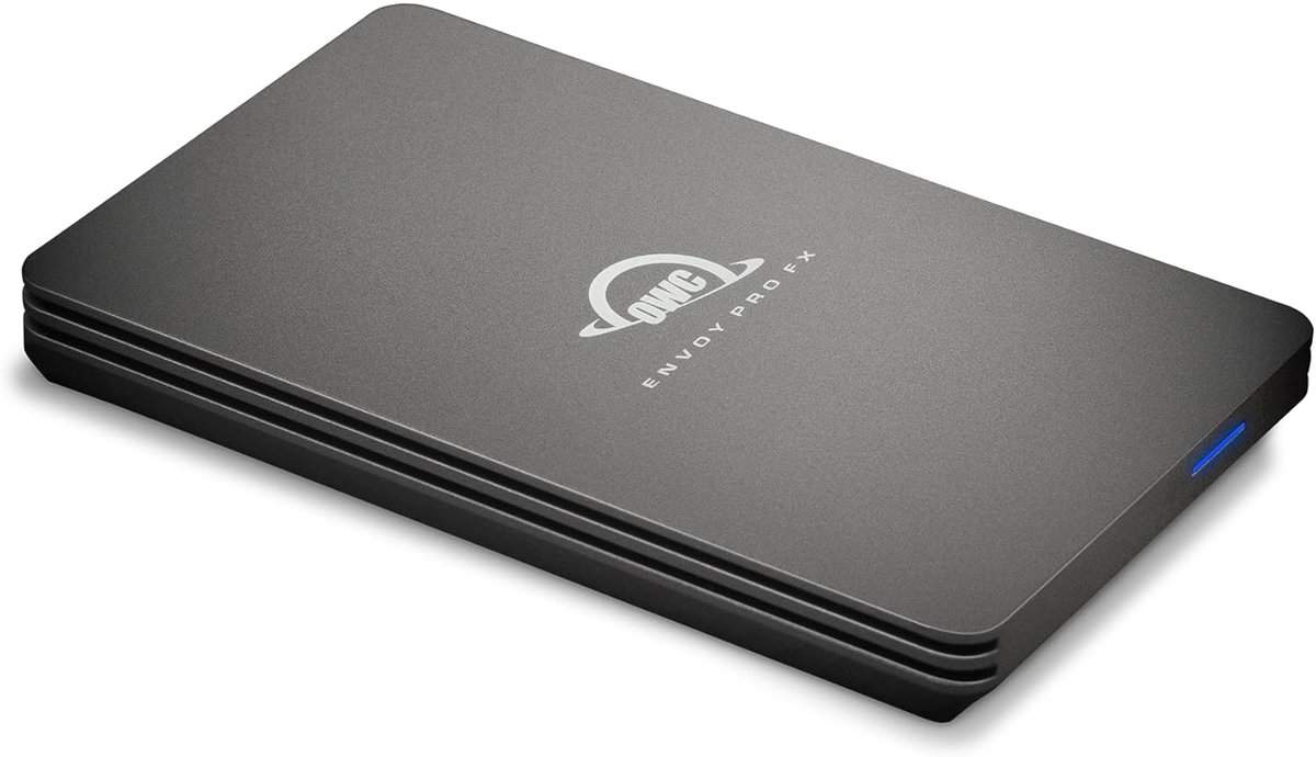 The sleek, gray Envoy Pro FX external hard drive, with its minimalist design and blue indicator light, makes an excellent holiday gift. Its rounded edges and logo on top give it a modern touch.